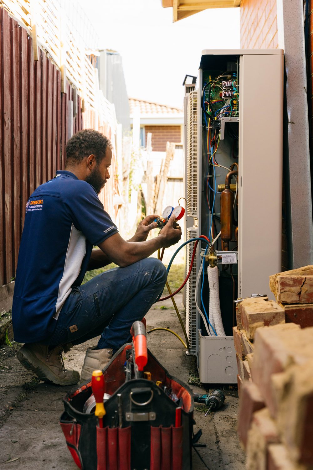Technician installing a split system